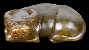 A contemporary Chinese spinach jade carving of a recumbent buffalo