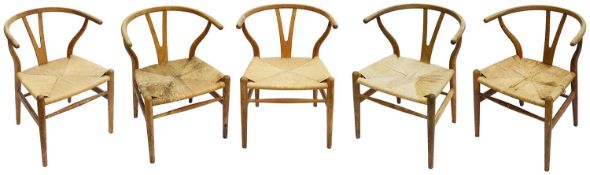 A set of five Hans Wegner (1914-2007) for Carl Hansen & Son Denmark oak CH24 wishbone dining chairs