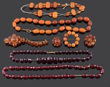 A small collection of Victorian amber brooches and other amber