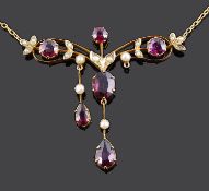 A delicate Edwardian garnet and seed pearl set scroll necklace
