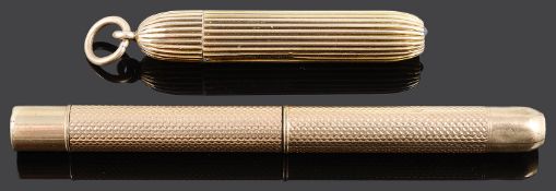 Two yellow metal propelling pencils