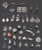 An interesting collection of Victorian silver earrings and a selection of mainly silver charms