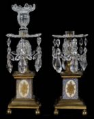 A pair of George III ormolu mounted lustre candlesticks (2)