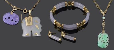 An attractive Art Deco carved jade pendant necklace together with other jade items