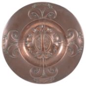 An Arts and Crafts copper alms dish
