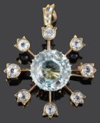 An early 20th Century aquamarine and gem set starburst pendant brooch