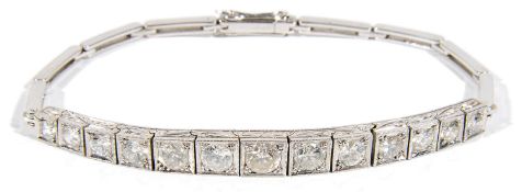 An attractive Edwardian diamond set graduated half line bracelet
