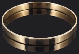A plain Continental 9ct gold slave bangle
