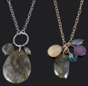 Two Monica Vinader pendants with pouches