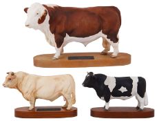 A Beswick Connoisseur Polled Hereford Bull on a wooden plinth and two others