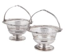 A pair of Edward VII silver swing handled bon bon baskets