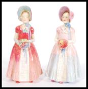 Two Royal Doulton Hand Painted Porcelain Figures both entitled ' Diana '.One pink and Blue