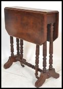 A Victorian mahogany Sutherland table being raised on ring turned legs with drop leaves raised on