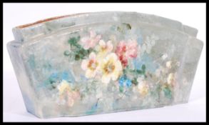 A 20th century studio art pottery ceramic flower vase of lozenge form being handpainted with