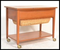 A vintage retro 20th Century Danish teak wood sewing / work box, solid flared top over full length