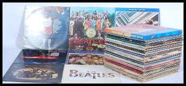 A collection of vinyl long play records by various artists to include Slade, The Romantics, Smokey