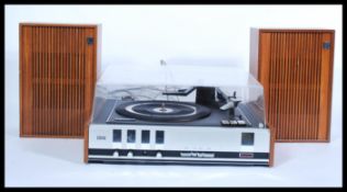 A retro 20th Century Phillips teak cased record player having a smoked acrylic top three speed