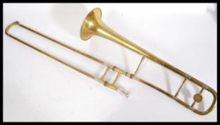 A 20th Century brass J. R. Lafleur & Sons trumpet no. 17276 in a leather carrying case, with