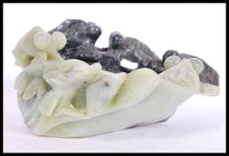 An unusual Chinese large jade / soapstone carved bowl depicting various big eyed fish in deep