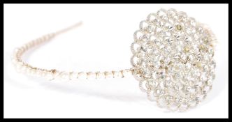 A vintage early 20th Century white rhinestone and freshwater pearl headband Harlow headpiece with