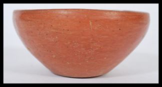 An ancient antique Roman pottery bowl. Simple red