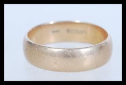 A hallmarked 9ct gold band ring of plain form baring London hallmarks. Weighs 6 grams. Size X.