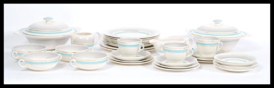 A vintage retro Clarice Cliff part tea / dinner service having blue stripes and gilt detailing