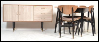 A retro 20th Century circa 1970's dining suite, consisting of a matching sideboard and extendable