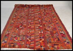 A  stunning large ethnic tribal carpet rug of handwoven bright vivid form, constructed from
