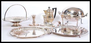 A good collection of silver plated wares to include serving trays, muffin warmer, coffee pot,