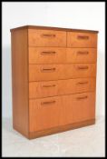 A retro 20th Century teak chest of drawers by Meredew. Having an arrangement of two short over
