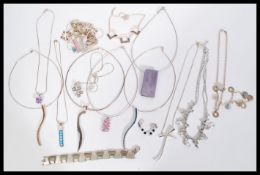 A collection of contemporary designer sterling silver 925 necklaces, pendants and bracelets to