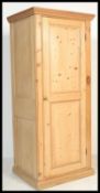 A 19th Century Victorian stripped / scrubbed  pine single door sentry batchelors wardrobe, shaped