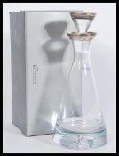 A Boadway glass pyramid decanter having a silver hallmarked collar / ring to the top in a Broadway