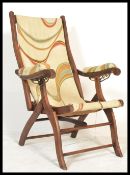 A Victorian mahogany folding campaign - steamer chair of beech construction having a mid century /