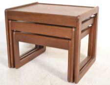 A mid century retro / vintage Danish influence teak wood nest of tables. Each top of graduating size