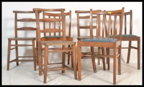 A collection of 20th century dining chairs to include mid century rail back dining chairs, chapel