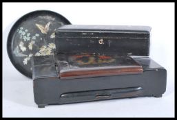 A collection of 19th century papier mache items to include a ladies vanity set with contents a black