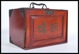 A vintage early 20th century Oriental Chinese Mahjong set, contained within a teak wood cabinet with