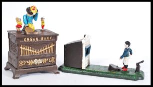 TWO CONTEMPORARY CAST IRON MONEY BANKS