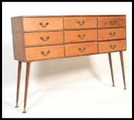 A 20th Century vintage industrial nine drawer sectional cabinet, each drawer with fitted with swag