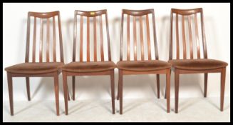 G Plan - A set of four retro 20th Century G Plan Fresco teak wood rail back dining chairs, drop in