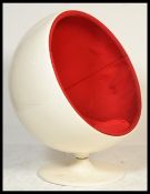 A 20th century / contemporary pod swivel chair / armchair  in the style of Eero Saarinen in white