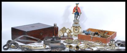 A collection of 20th Century horse brasses, along with a oil lamp base, a brass candle holder with