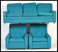 A vintage retro three piece suite comprising sofa and two arm chairs in woollen Bitossi colours,