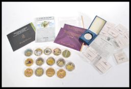 A collection of 15 Commemorative coins, to include gold plated and silver proof examples to incliude
