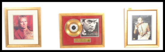 A framed presentation Phil Collins gold disc to commemorate worldwide sales of Something Happened On