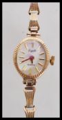 A 9ct gold hallmarked ladies dress watch / cocktail wristwatch and gold bracelet strap by Everite.