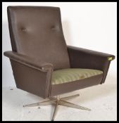 A danish 1970's faux grained leather swivel desk / lounge chair / armchair having tall buttoned