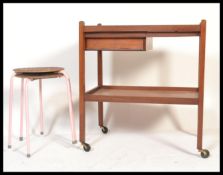 A pair dot stool chairs in the manner of Arne Jacobsen for Fritz Hansen. Each on tubular frames with